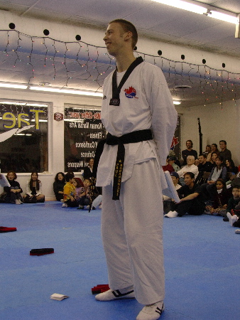 Photo: Paul Baranowski stands proudly just after having received his black belt in Taekwondo.