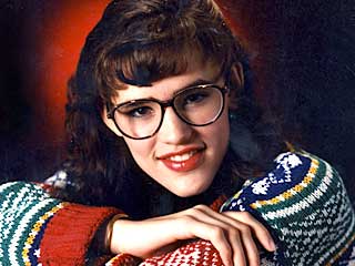 Photo: A young Jennifer Garner in big glasses and 80's-era sweater and hairdo.