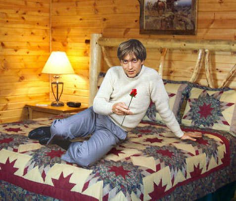 Photo: Bill Gates reclining in a hotel room, proferring a rose.