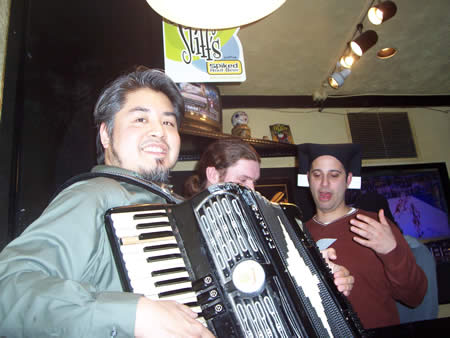 Photo: Joey deVilla plays accordion while Greg Frank plays air guitar at 'The Toad in the Hole' on St. Patrick's Day 2005.