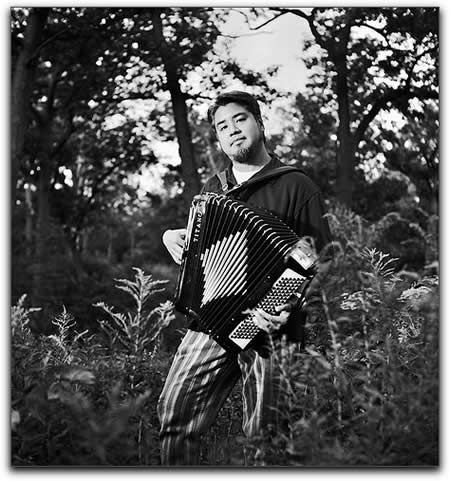 Photo: Joey deVilla poses with his accordion in High Park for one of Rannie Turingan's 'Portraits in the Park'.