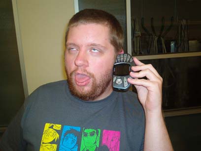 Photo: Guy enjoying his Nokia N_Gage phone a little too much.