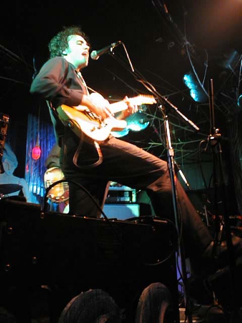 Hawksley Workman plays guitar at his show at the Rivoli, December 1999.