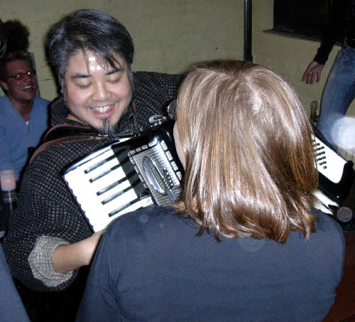 Joey plays accordion for Wendy at Kickass Karaoke.