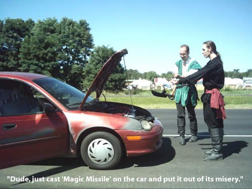 Two guys in Ren Faire outfits looking at their broken-down Ford Focus on a highway shoulder.