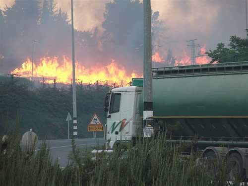 Photo of Kibbutz Kfar Giladi on fire.