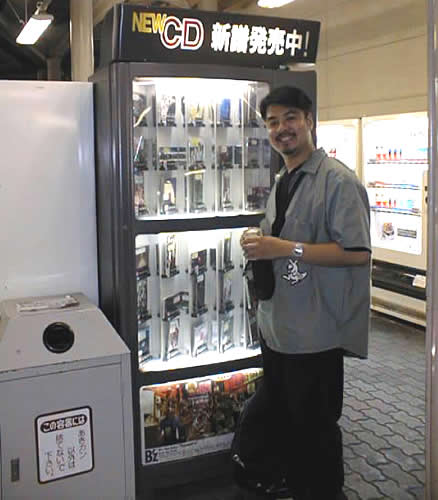 Joey deVilla at a CD vending machine in the train station in Kyoto, Japan, October 1998.