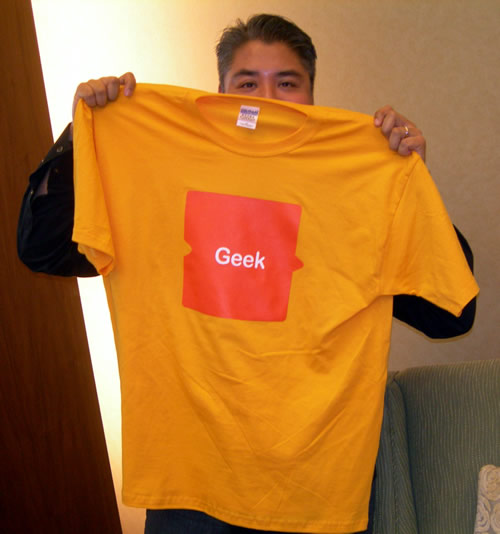 Joey deVilla showing off his AOL 'Geek' t-shirt.