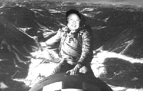 Photoshopped picture with Kim Jong Il's face on the body of 'Major Kong' from 'Doctor Strangelove' riding the missle.