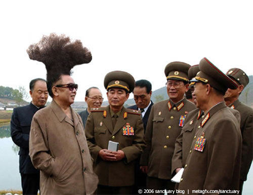 Kim Jong Il (with nuclear hairdo) greeting his generals.