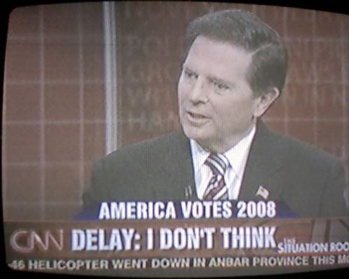 Photo of TV showing CNN with caption: 'DeLay: I Don't Think'.