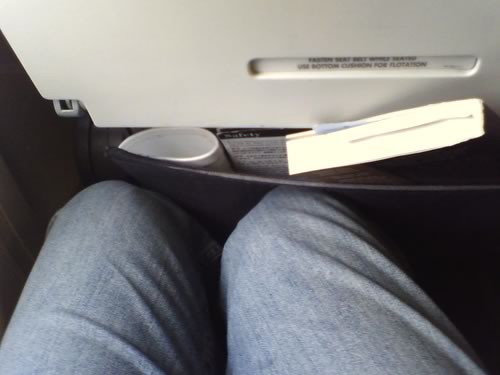 Stephen O'Grady's photo of the legroom in a United Airlines economy class seat.