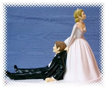 Cake topper featuring the bride dragging a drunken groom by his collar
