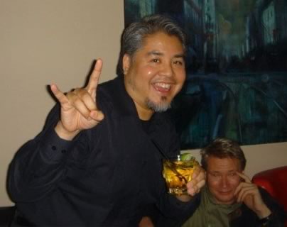 Joey deVilla, throwing the horns and having a Red Bull and vodka at his 40th birthday party