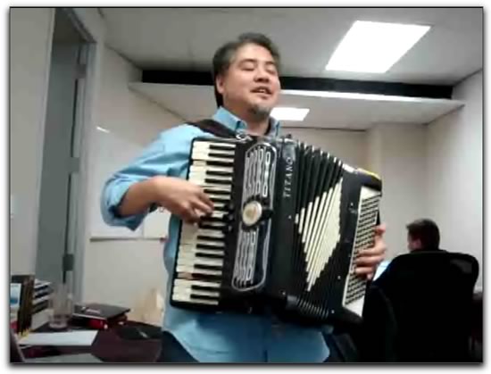 Joey deVilla playing accordion at the TSOT offices