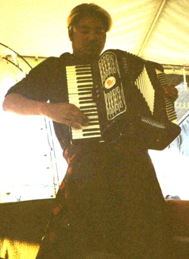 Joey deVilla playing accordion at Burning Man