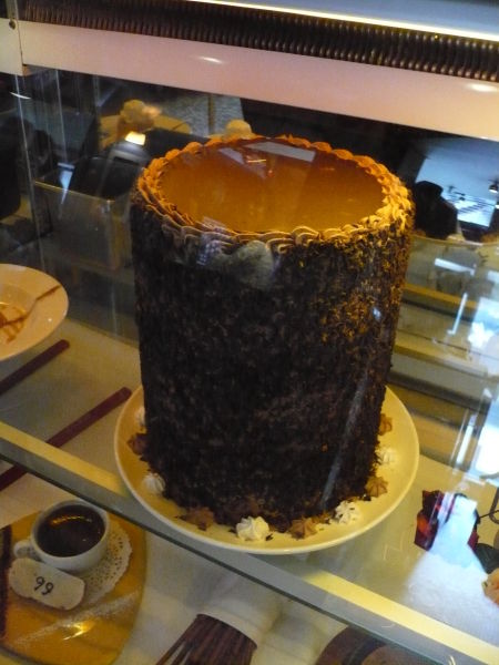 A whole colossal cake sitting in the dessert fridge at Wayne Gretzky’s