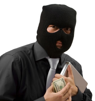 Scam artist wearing a black hood carrying a wad of bills.