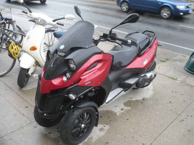 Front-and-side view of Jeremy Wright's Piaggio MP3 scooter