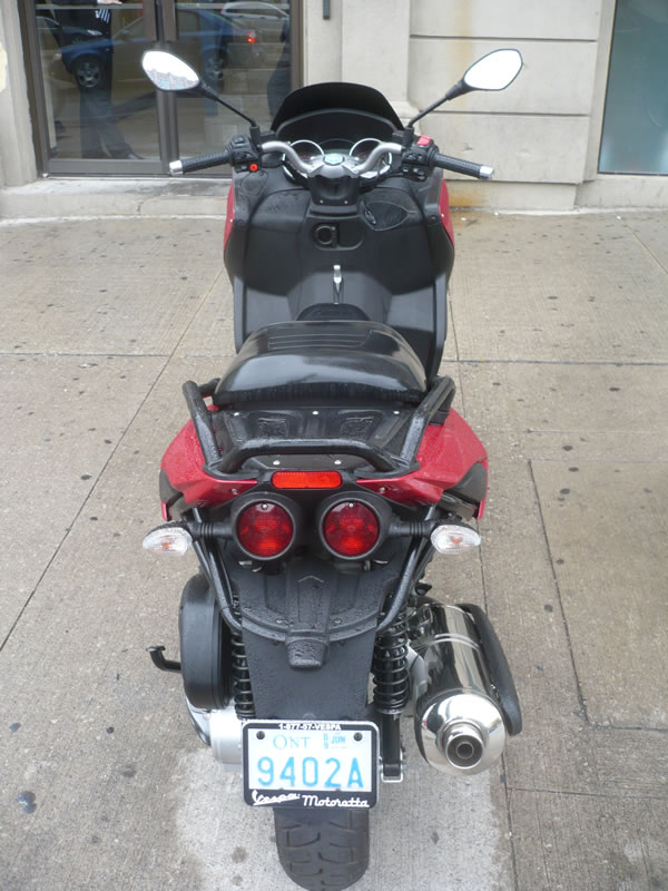 View of rear of Jeremy's Wright's Piaggio MP3 scooter