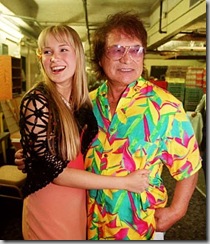 Don Ho, in an aloha shirt, with his daughter Hoku