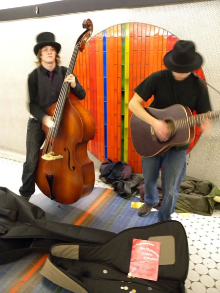 Upright bass player and guitar player in Montreal Metro