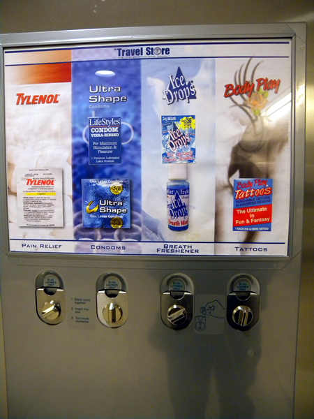 "Travel store" vending machine featuring: Tylenol, condoms, Ice Drops breath mints and Body Play tattoos.