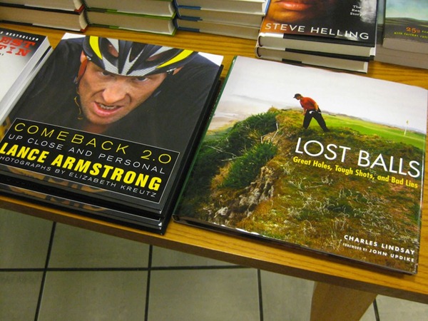Table at bookstore with a Lance Armstrong book places beside a book titled "Lost Balls"