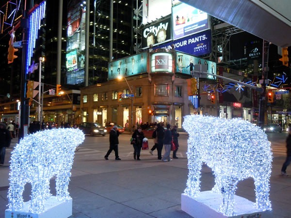 Corner of Yonge and Dundas, looking northwest between two polar bears made of lights