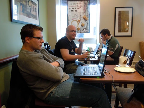 John Bristowe, Fred Harper and David Wesst work on their laptops at the Osborne Village Second Cup cafe.