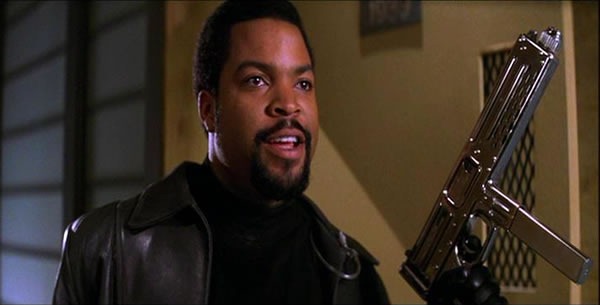 Ice Cube in the movie "Trespass", wearing a black turtleneck, a black leather jacket and holding a silver MAC-10. Damn!