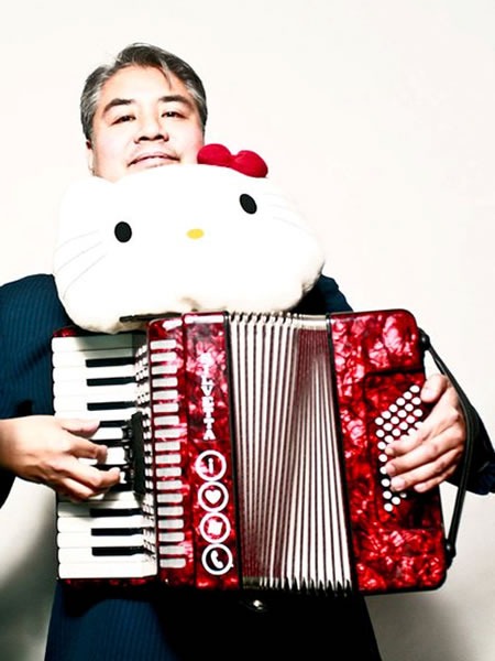 Joey deVilla and his read accordion with a big "Hello Kitty" head