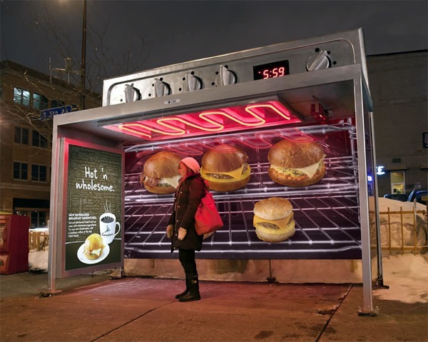 Bus stop done up to look like a large oven with baked goods and sandwiches