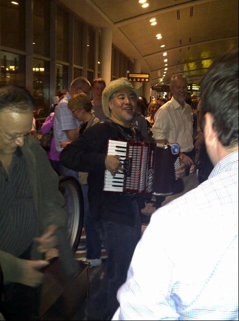 joey in customs line on accordion