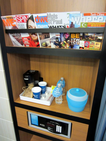 Closeup of the magazine rack, beverage shelf and safe in the closet