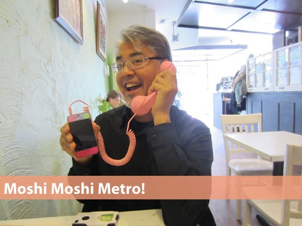"Moshi Moshi Metro!" Joey deVilla at Cafe Novo, holding Verna Kulish's pink iPhone connected to a pink Moshi Moshi handset.