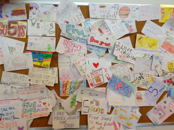 The 'compliments' bulletin board at a Five Guys in Tampa.