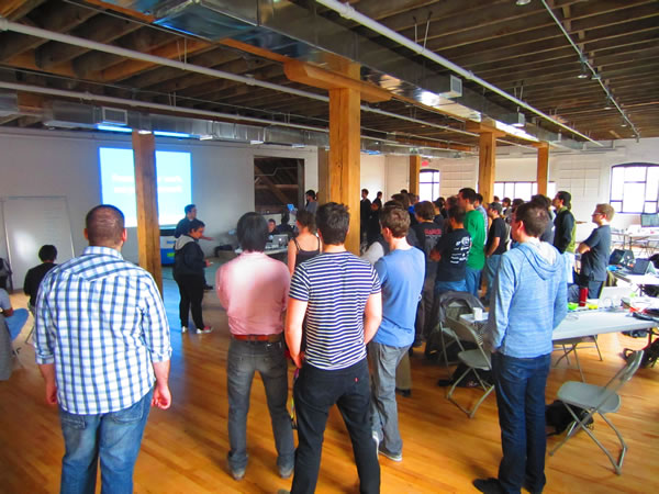 HackTO attendees watching the API presentations