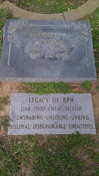 Gravestones: the first reads "Bernard P Hopkins - Dec 2 1904 - Jan 22 1993". The second reads: "Legacy of BPH: Liar - Thief - Cheat - Selfish - Unsharing - Unloving - Unkind - Disloyal - Dishonorable -  Unfaithful"