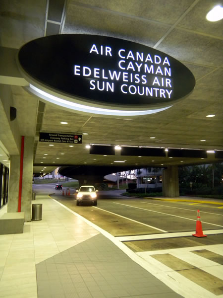 Tampa airport's arrivals pick-up point for Air Canada, Cayman, Edelweiss and Sun Country airlines