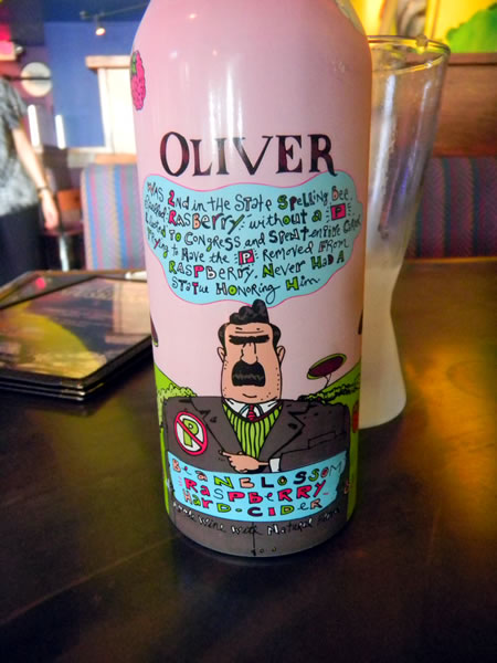 Bottle of Oliver Hard Raspberry cider with cartoony label