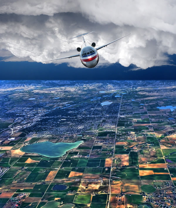 American airlines jet flying over the countryside