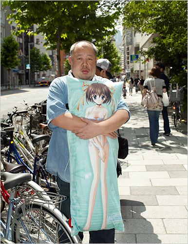 older guy with anime body pillow