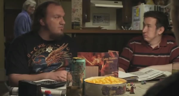 Still from Zero Charisma: Scott leading a fantasy role-playing gaming session with his friends.