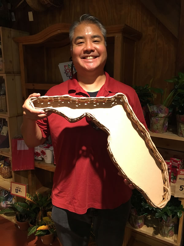 Joey deVilla poses with a Florida-shaped serving tray.