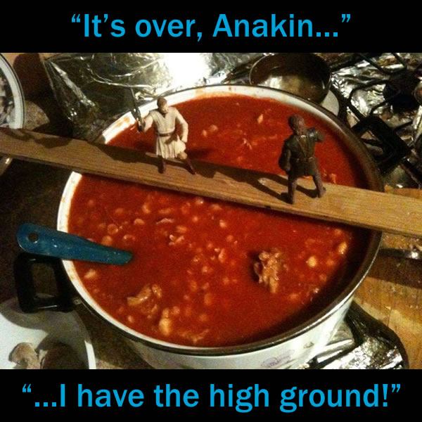 "It's over, Anakin! I have the high ground!": Obi-Wan Kenobi and Anakin Skywalker action figures fighting on a yardstick over a pot of hot chili.