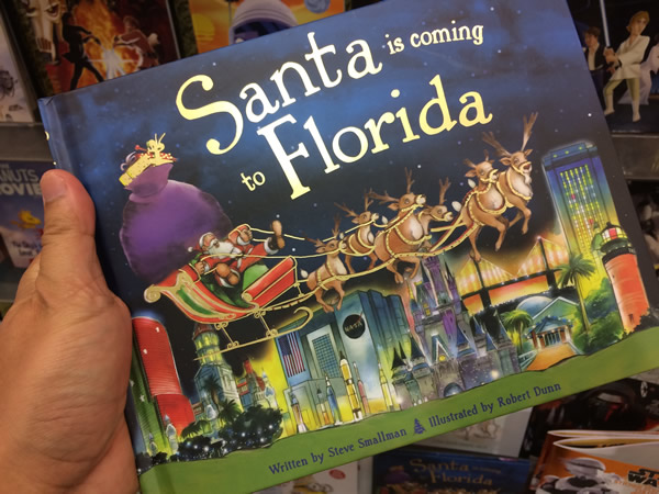 A book titled 'Santa is Coming to Florida'.