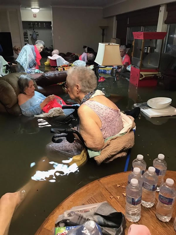 Residents of La Vita Bella Nursing Home in Dickerson, Texas wait for rescue in their flooded living room.