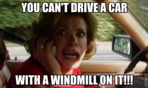 "Lucille" from "Arrested Development" driving a car, yelling on her mobile phone, captioned with "You can't drive a car with a windmill on it!"