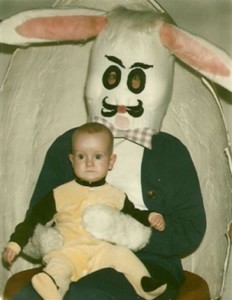Concerned-looking child sitting in creepy Easter Bunny's lap